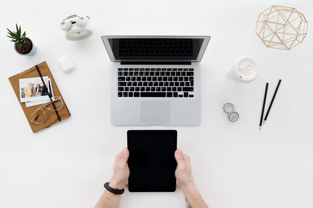 Person Holding Black Tablet Computer 